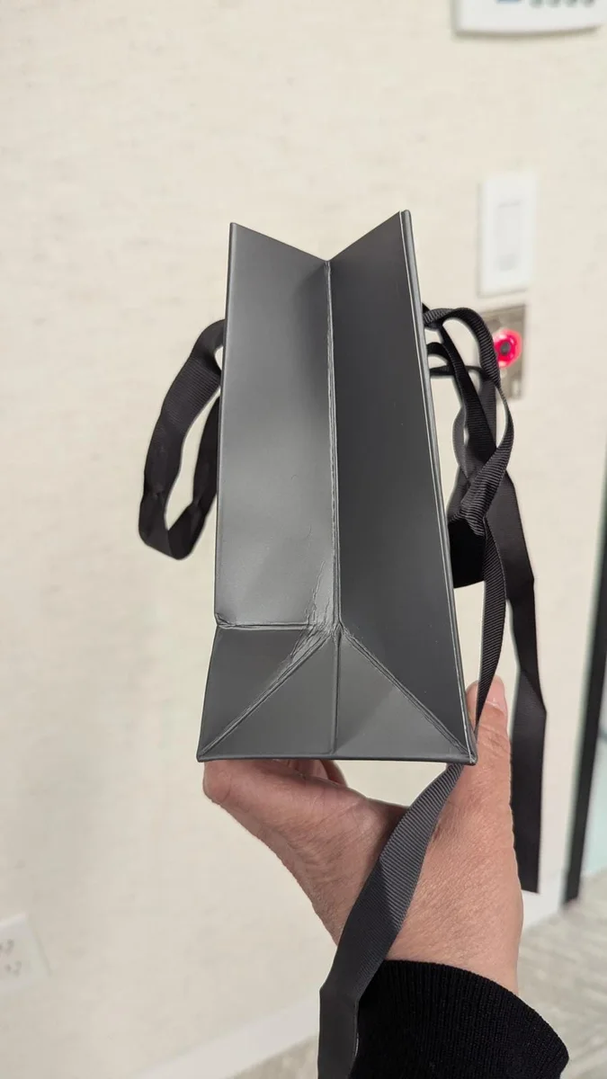 Grey paper bag with rope handles