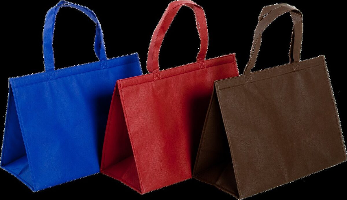 Custom printed non-woven reusable bags in a stack